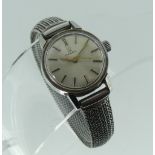An Omega stainless steel lady's Wristwatch, with Swiss movement, the circular silvered dial with