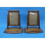 A pair of antique mahogany Swing Photo Frames, with domed glass upon a solid base, 6½in (16cm) wide