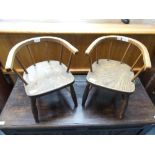 A pair of antique ash and elm Child's stick-back Bow Armchairs, with a solid seat, on turned legs,