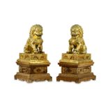 A PAIR OF LARGE CHINESE GILT-SILVER LIONS AND STANDS.