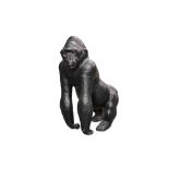 A MID 20TH CENTURY LEATHER COVERED MODEL OF A GORILLA