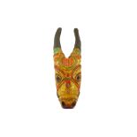 A WALL HANGING DEPICTING THE HINDU GOD NANDI (SHIVA) IN THE FORM OF A BULL