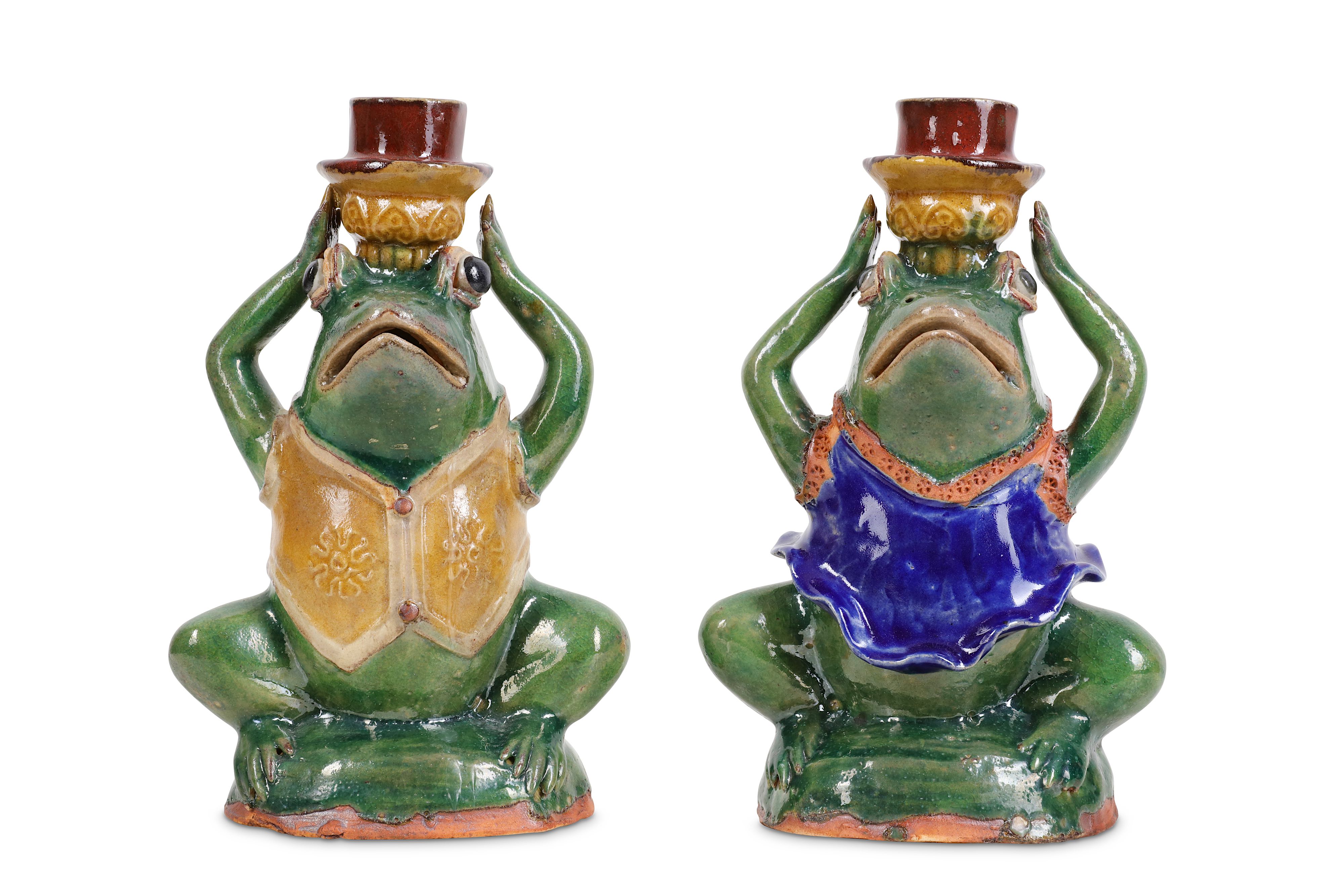 A PAIR OF 20TH CENTURY JAPANESE GLAZED CERAMIC CANDLESTICKS MODELLED AS FROGS
