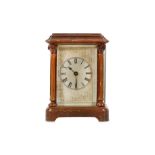 A LATE 19TH CENTURY FRENCH CARRIAGE CLOCK IN A CARVED WOOD CASE