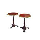 A PAIR OF EARLY 20TH CENTURY FRENCH CAST IRON, BRASS AND GLASS BISTRO TABLES