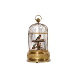AN EARLY 20TH CENTURY GILT BRASS SINGING BIRDS IN CAGE AUTOMATON