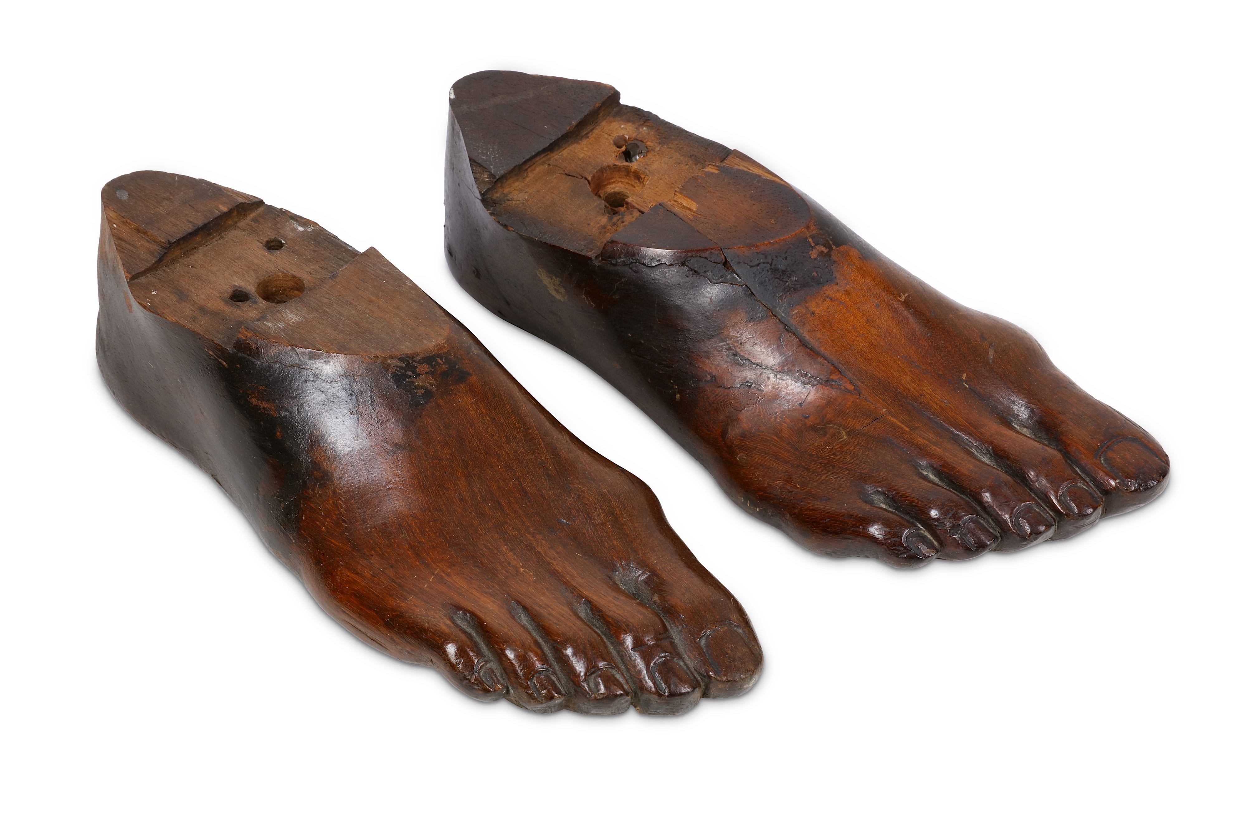 TREEN: A PAIR OF 19TH CENTURY CARVED FRUITWOOD RIGHT FEET