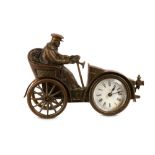 AN EARLY 20TH CENTURY AMERICAN BRONZE CLOCK MODELLED AS AN AUTOMOBILE BY THE ANSONIA CLOCK CO.