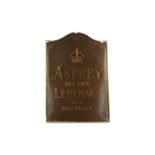 A early 20th century Asprey Sign, painted and gilded on a mesh backing within a bronze frame, the