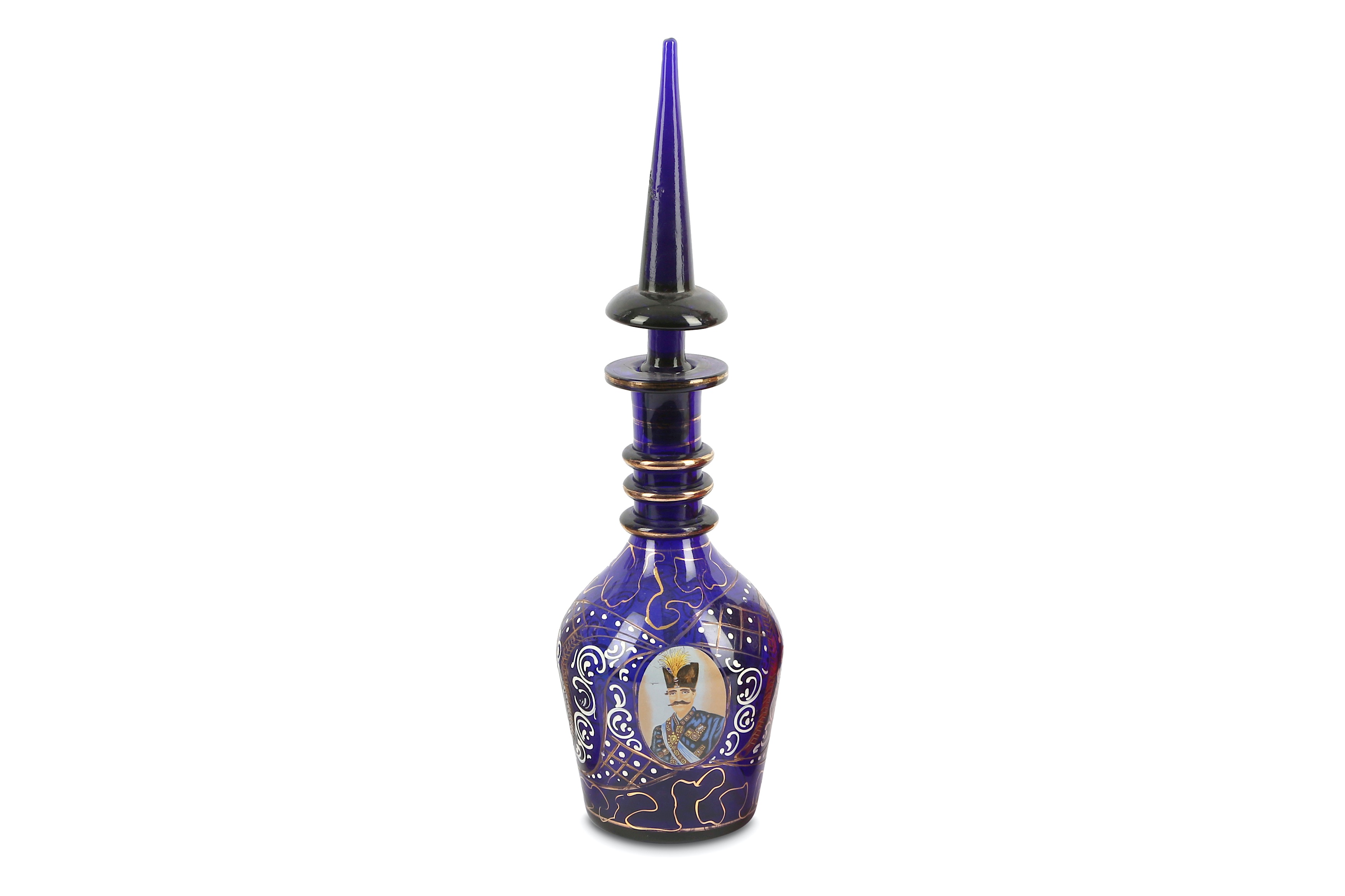 A late 19th early 20th century Bohemian glass decanter, the Bristol blue decanter of Persian design,