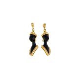 A pair of wood and diamond Blackamoor earrings
