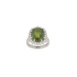 A green sapphire and diamond cluster ring