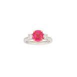 A pink sapphire and diamond three-stone ring