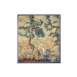 A 19TH CENTURY VERDURE TAPESTRY DEPICTING A WOODED MILL SCENE WITH STORKS depicting a mill