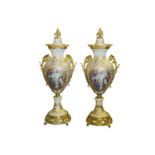 A LARGE PAIR OF LOUIS XVI STYLE PORCELAIN AND GILT METAL VASES  of baluster form with domed covers