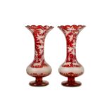 A PAIR OF 19TH CENTURY BOHEMIAN RUBY GLASS VASES the long slender necks with everted, scallop-