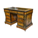 A VICTORIAN BURR WALNUT, OLIVEWOOD AND EBONISED PEDESTAL DESK IN THE MANNER OF HOLLAND & SONS with