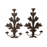 A PAIR OF EARLY 20TH CENTURY FRENCH WROUGHT IRON HANGING WALL LIGHTS the backplates modelled as