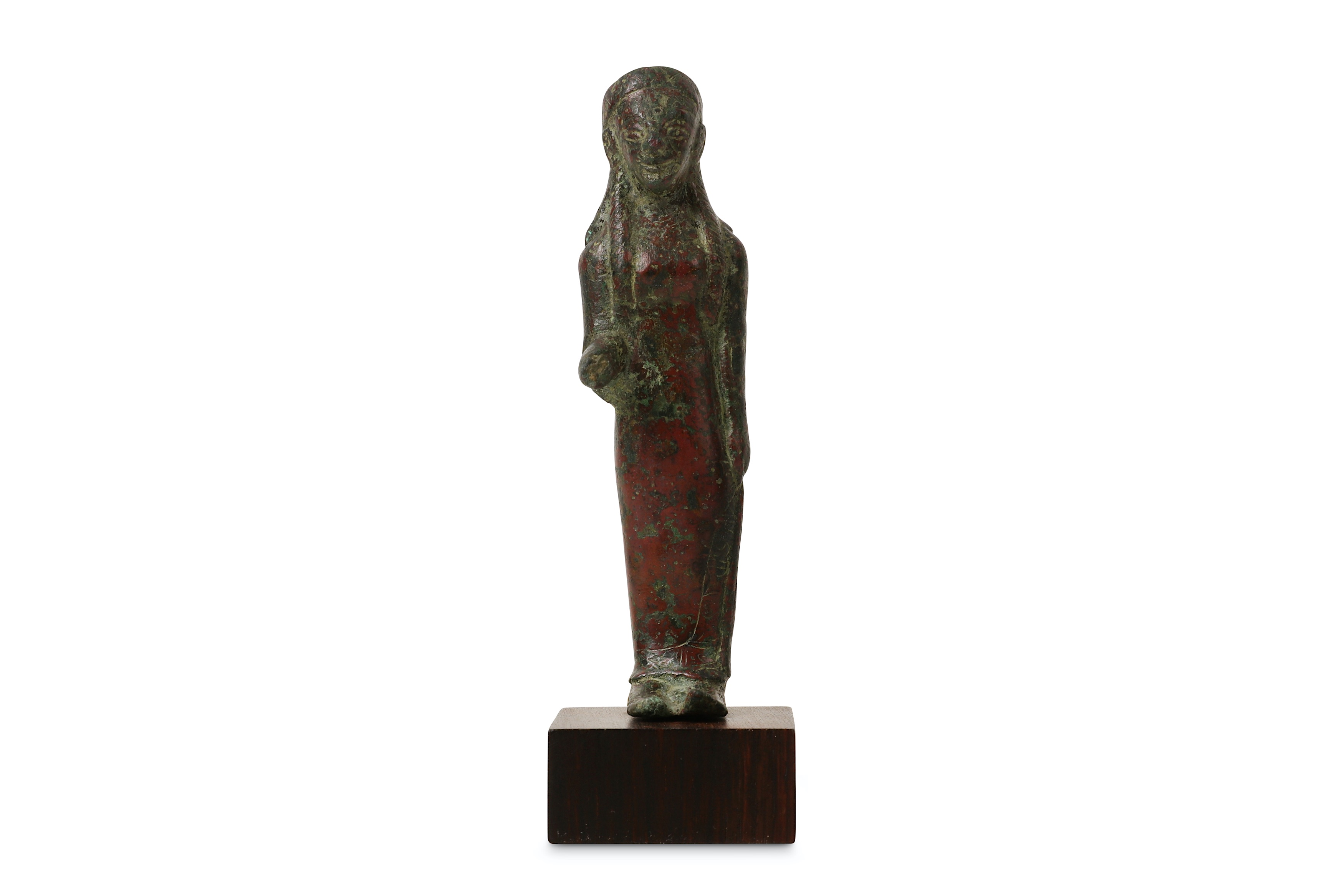 A 6TH CENTURY B.C. ETRUSCAN BRONZE KORE FIGURE raised on a later stained wood base,  the figure 10cm