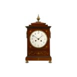 A 19TH CENTURY MAHOGANY AND BRASS MOUNTED BRACKET / TABLE CLOCK  in the Regency style, surmounted by