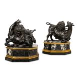 A PAIR OF 17TH / EARLY 18TH CENTURY BRONZE GROUPS DEPICTING LION ATTACKING A BULL AND LION ATTACKING