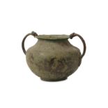 A 3RD CENTURY B.C. HELLENISTIC BRONZE VESSEL  of globular form with a pair of handles modelled
