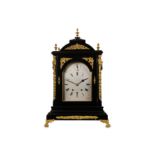 A 19TH CENTURY EBONISED AND GILT BRASS MOUNTED MUSICAL QUARTER CHIMING BRACKET / TABLE CLOCK the