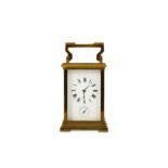AN EARLY 20TH CENTURY FRENCH LACQUERED BRASS CARRIAGE CLOCK WITH ALARM the white enamelled dial with