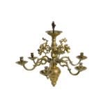 A 17TH CENTURY FLEMISH (FLANDERS) BRASS SIX LIGHT CHANDELIER the central stem surmounted by a