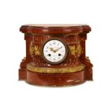 A THIRD QUARTER 19TH CENTURY FRENCH ROUGE MARBLE AND GILT BRONZE MOUNTED MANTEL CLOCK BY MAISON