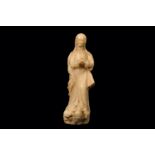 A 17TH CENTURY SICILIAN (TRAPANI) CARVED ALABASTER FIGURE OF THE MADONNA the Virgin with flowing