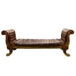 A FINE REGENCY FAUX ROSEWOOD, PARCEL GILT AND BURGUNDY LEATHER OPEN SOFA the volute scroll ends with