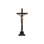 A 19TH CENTURY BRONZE CORPUS CHRISTI ON EBONISED CRUCIFIX wearing a rope tied perizonium, traces