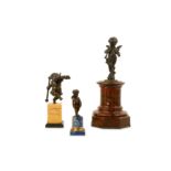 A SMALL 18TH CENTURY FRENCH BRONZE FIGURE OF A PUTTO ON LAPIS LAZULI PLINTH TOGETHER WITH TWO OTHERS