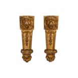 A PAIR OF 19TH CENTURY ITALIAN GILTWOOD LION MASK WALL MOUNTS each lion mask carved above a tapering
