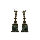 A PAIR OF 19TH CENTURY FRENCH EMPIRE STYLE BRONZE FIGURES OF PUTTI the winged cherubs with long