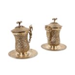 A PAIR OF EGYPTIAN SILVER SAHLEP CUPS decorated with a fish scale design throughout, the domed
