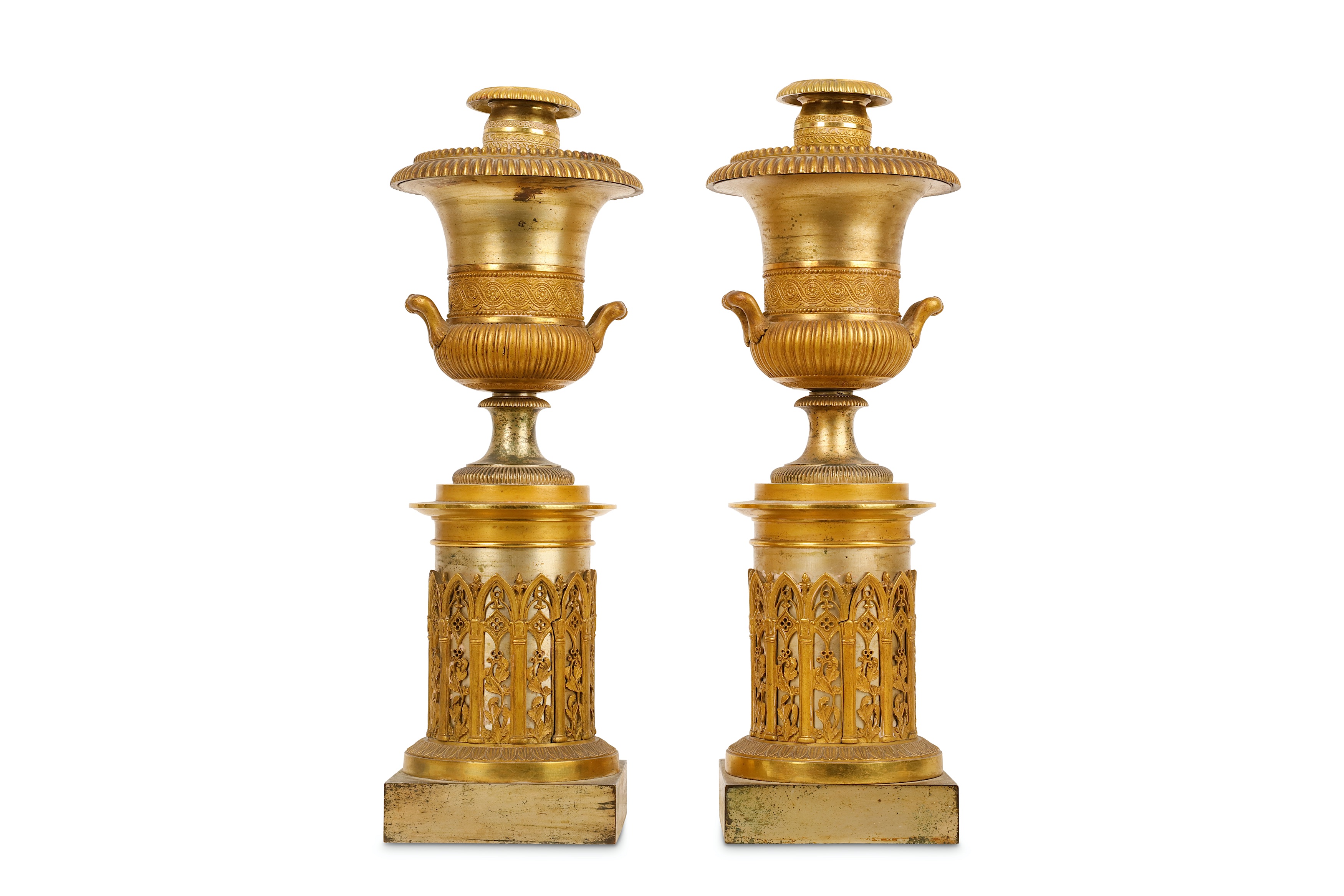 A PAIR OF SECOND QUARTER 19TH CENTURY FRENCH GILT AND SILVERED BRONZE CANDLESTICKS FORMED AS URNS