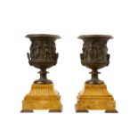 A PAIR OF LATE 19TH CENTURY FRENCH BRONZE AND SIENNA MARBLE URNS ON STANDS of Campana form, with