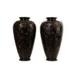 A PAIR OF LATE 19TH CENTURY JAPANESE MEIJI PERIOD BRONZE VASES of baluster form, decorated in relief
