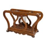 AN UNUSUAL LATE REGENCY ROSEWOOD MUSIC ROLL HOLDER CIRCA 1820 the scrolling frame centred by a