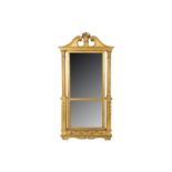 AN EARLY 19TH CENTURY GILTWOOD MIRROR carved on both sides, with scrolling swan neck pediment