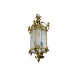 A LATE 19TH CENTURY GILT BRONZE AND ETCHED GLASS HALL LANTERN of cylindrical form with scrolling