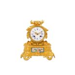 A MID 19TH CENTURY FRENCH GILT BRONZE AND PORCELAIN MOUNTED MANTEL CLOCK  the drum case surmounted