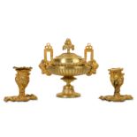 A LATE 19TH CENTURY FRENCH GILT BRONZE URN AND COVER TOGETHER WITH A PAIR OF CANDLESTICKS the bowl