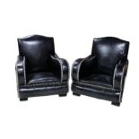 AN EXCEPTIONAL PAIR OF MID 20TH CENTURY ART DECO STYLE ARMCHAIRS upholstered in black leather and