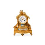 A MID 19TH CENTURY FRENCH GILT BRONZE AND PORCELAIN MOUNTED MANTEL CLOCK the arched case topped with