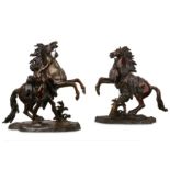 AFTER GUILLAUME COUSTOU (FRENCH, 1677-1746): A LARGE PAIR OF 19TH CENTURY BRONZE MODELS OF THE