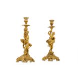 A PAIR OF LATE 18TH / EARLY 19TH CENTURY FRENCH GILT BRONZE CANDLESTICKS AFTER THE MODEL BY