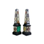 A LARGE PAIR OF FLOOR STANDING SPECIMEN MARBLE OBELISKS  decorated throughout with various marbles